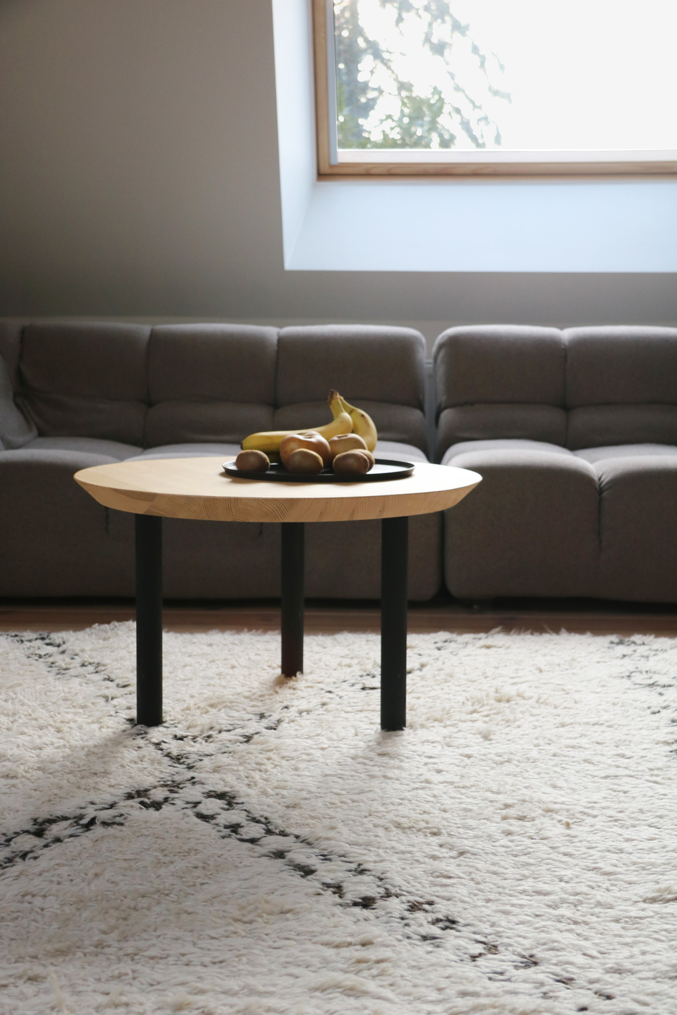Nonjetable-Round-Solid-Pine-Table-in-Front-of-Sofa
